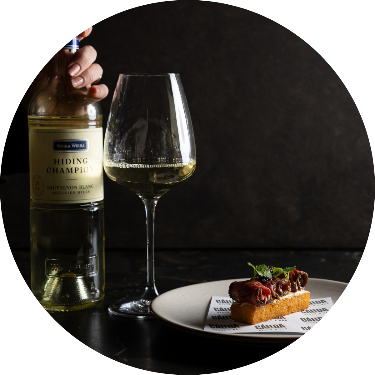 Image of the Wirra Wirra Hiding Champion wine and brioche wagyu.